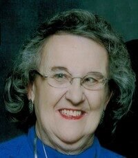 Smiling elderly woman with glasses and gray hair